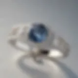A close-up view of a white gold ring showing its initial luster
