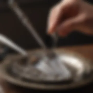 Silverware being polished with aluminum foil