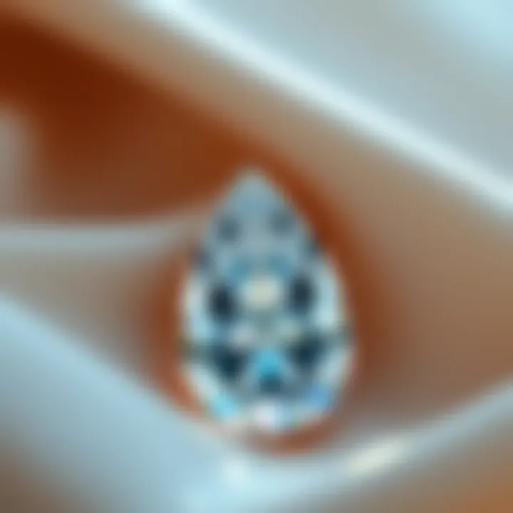 Pear-Shaped Diamond Elegance An elegant pear-shaped diamond resting on a soft fabric background