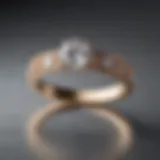 A close-up of a modern, minimalist engagement ring with a unique geometric design.