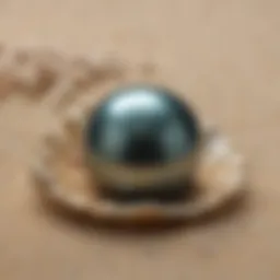 Radiant Tahitian pearl resting on a bed of soft sand