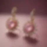 Elegant pink star sapphire earrings displayed on a velvet background