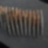 Close-up of various small needle files arranged neatly on a workbench, showcasing their unique shapes and sizes.