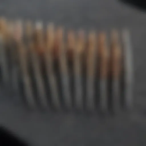 Close-up of various small needle files arranged neatly on a workbench, showcasing their unique shapes and sizes.