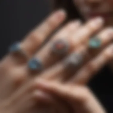 A finger adorned with rings demonstrating various styles and sizes.