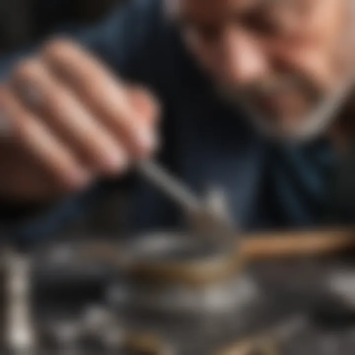 Jeweler using a planishing hammer on silver piece