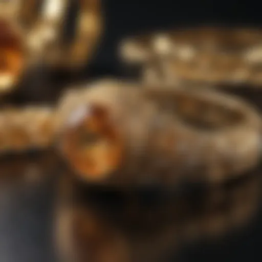 A close-up view of gold jewelry on a reflective surface.